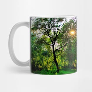 Wonderful curved tree surrounded with lush greenery Mug